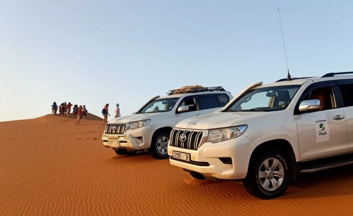 Toyota 4x4 vehicles on the dunes during a Sahara off-road expedition in Morocco