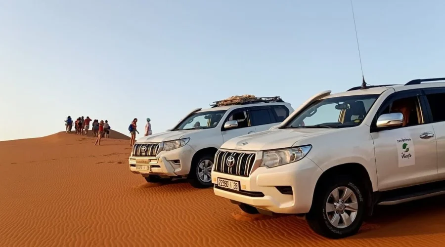 Toyota 4x4 vehicles on the dunes during a Sahara off-road expedition in Morocco